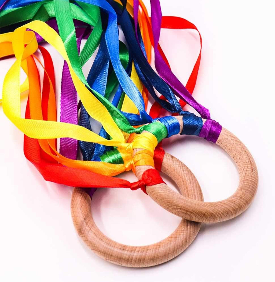 Waldorf Hand Kite Set for kids, featuring colorful rainbow ribbons and wooden rings, designed as a sensory toy to encourage creative movement, imaginative play, and sensory exploration.