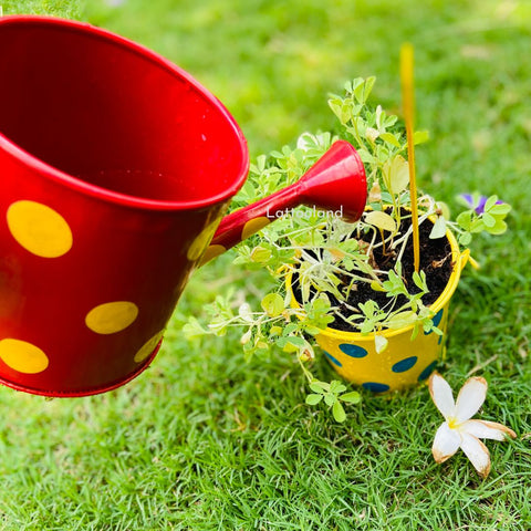 A colorful set of gardening tools designed for kids, perfect for outdoor fun and play. kids plant pot and watering can flower grow kit