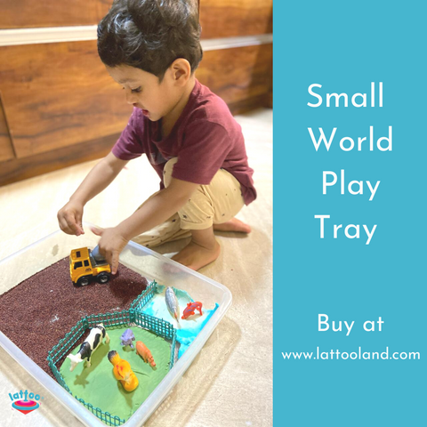 Montessori-inspired transparent sensory bin tray, ideal for educational and creative play setups.Small World Play set up in a Sensory bin and a small boy playing with it